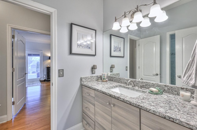 bathroom with vanity and hardwood / wood-style floors