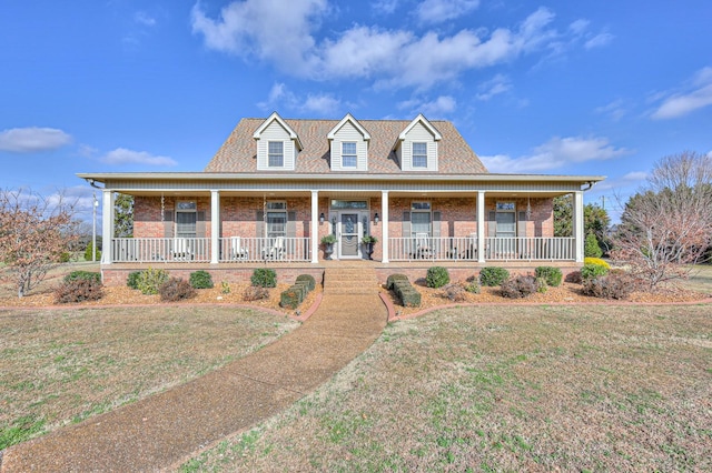 view of front of home featuring a front yard and a porch