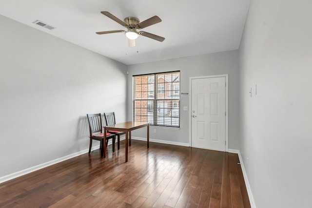 office space with ceiling fan and dark hardwood / wood-style floors