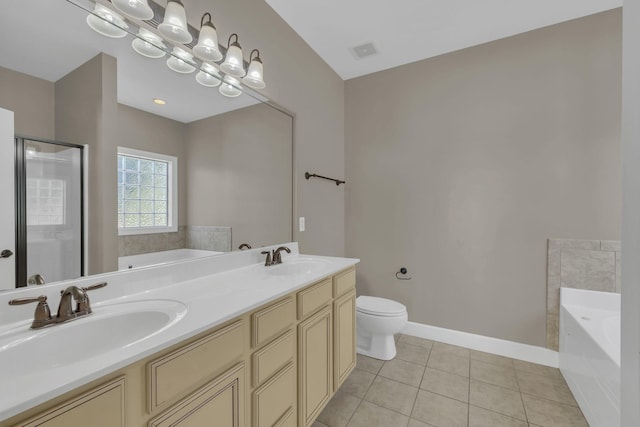 bathroom with toilet, tile patterned flooring, a bathtub, and vanity