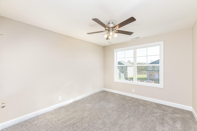 unfurnished room featuring carpet floors and ceiling fan