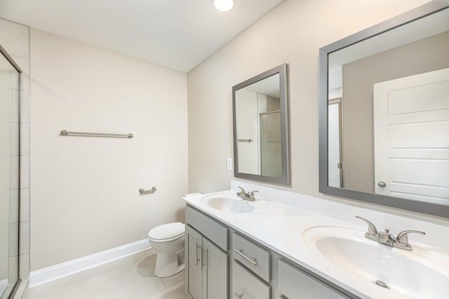 bathroom with toilet, vanity, an enclosed shower, and tile patterned flooring