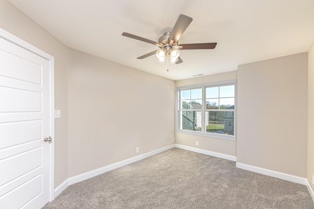 carpeted empty room with ceiling fan