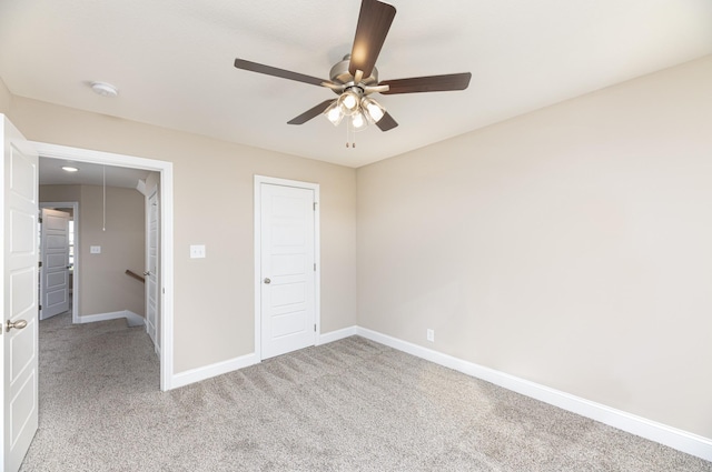 unfurnished bedroom featuring ceiling fan and light colored carpet