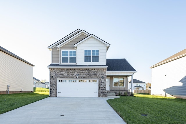 view of front of property featuring a front yard and a garage