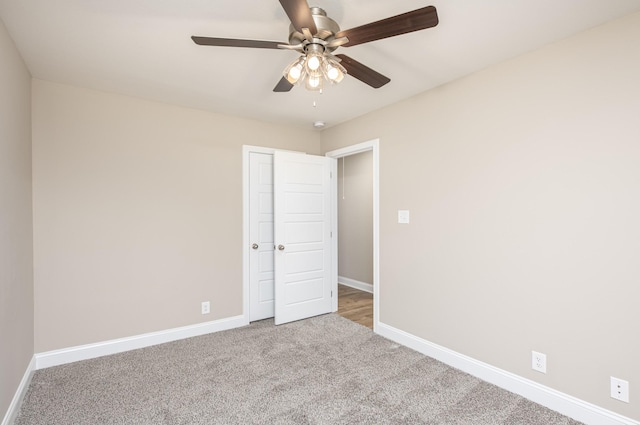 unfurnished bedroom featuring carpet floors and ceiling fan