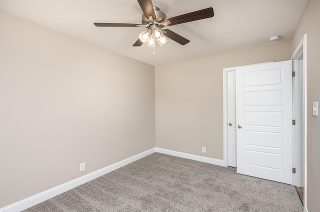 unfurnished room with carpet floors and ceiling fan