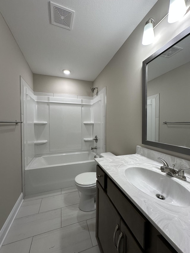 full bathroom featuring vanity, a textured ceiling, shower / bathtub combination, and toilet