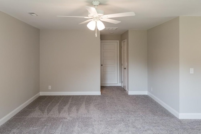 carpeted empty room with ceiling fan