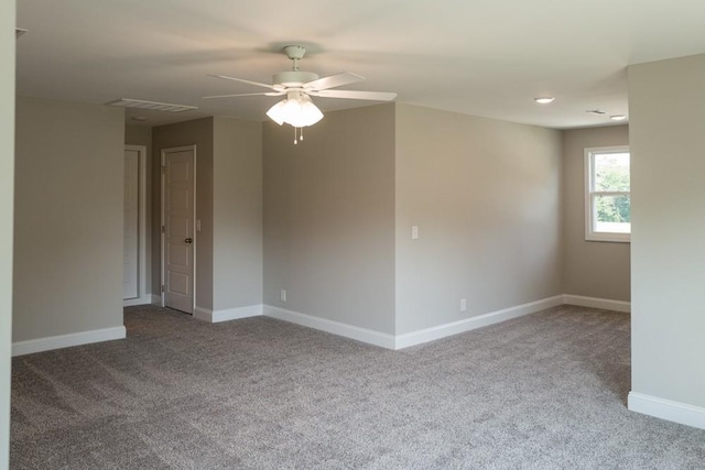 unfurnished room with ceiling fan and carpet flooring