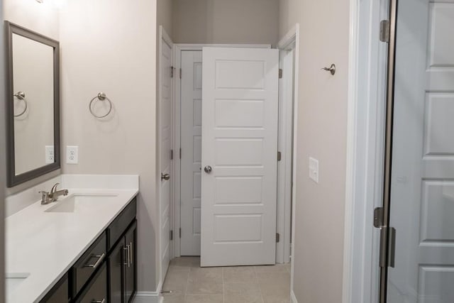 bathroom with tile patterned floors and vanity