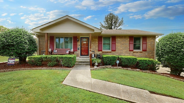 single story home with a front yard and covered porch