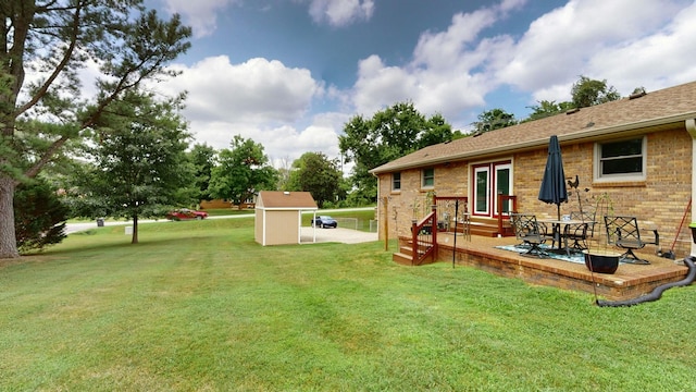 view of yard featuring a patio area and a shed