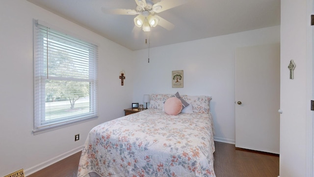 bedroom featuring ceiling fan and dark hardwood / wood-style flooring