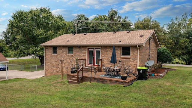 back of house featuring a patio area and a yard