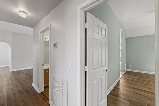 hall with dark hardwood / wood-style flooring