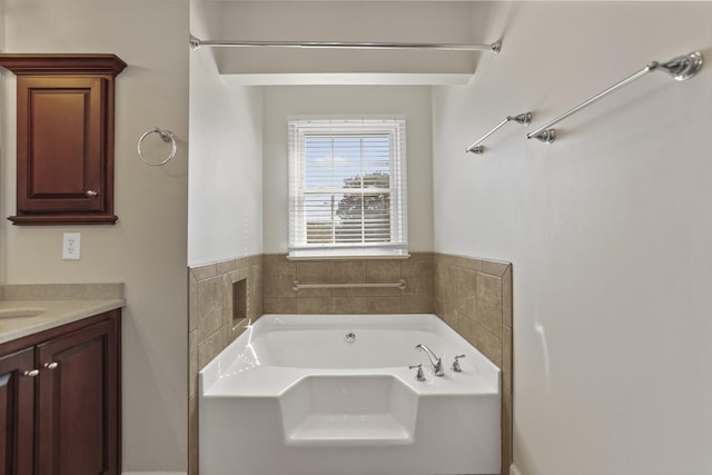 bathroom featuring vanity and a tub