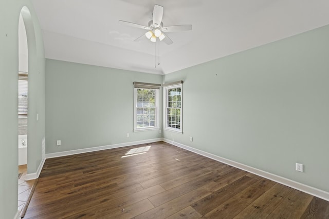 unfurnished room with ceiling fan and dark hardwood / wood-style floors