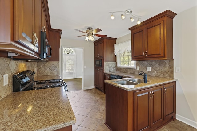 kitchen featuring light tile patterned floors, ceiling fan, light stone countertops, black appliances, and sink