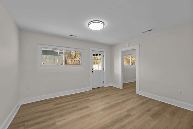 spare room featuring light hardwood / wood-style flooring