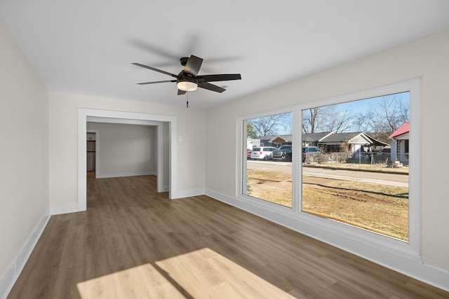 unfurnished room featuring ceiling fan and wood-type flooring