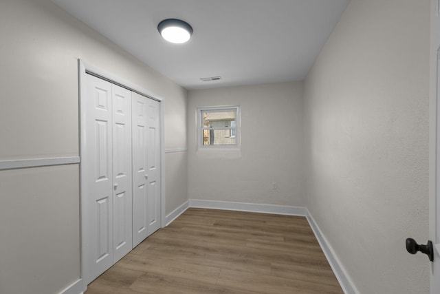 hallway with light wood-type flooring