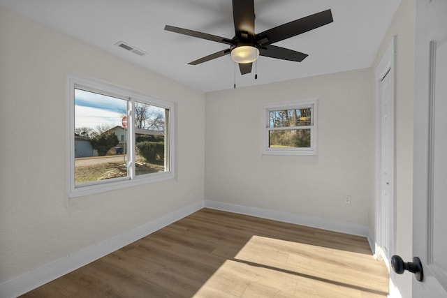 empty room featuring ceiling fan and wood-type flooring