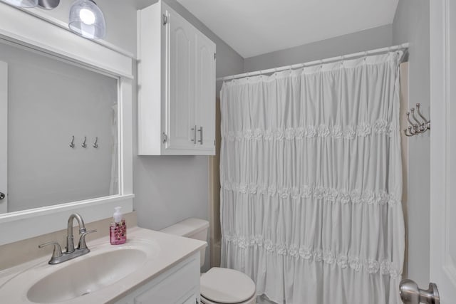 bathroom featuring toilet and vanity