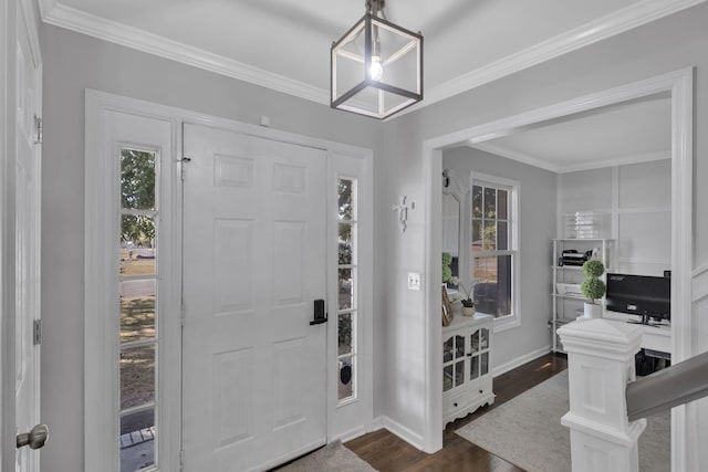 entrance foyer with dark hardwood / wood-style floors and crown molding