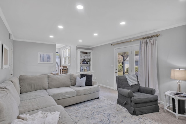 living room featuring light colored carpet, a wealth of natural light, and ornamental molding