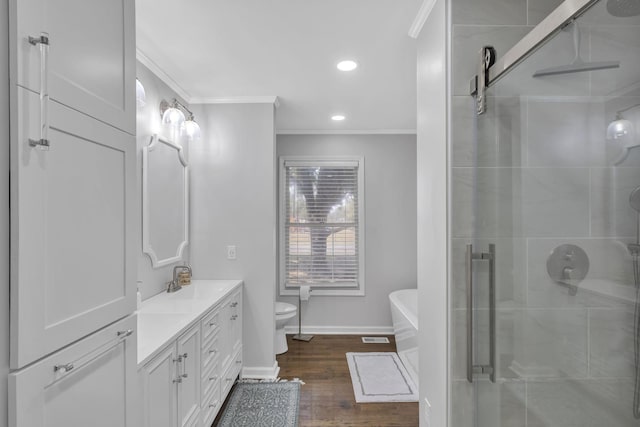 full bathroom featuring separate shower and tub, vanity, toilet, wood-type flooring, and crown molding