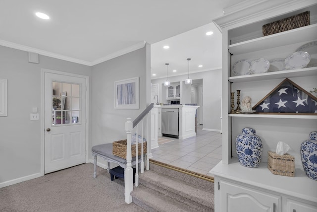 foyer with light colored carpet and crown molding