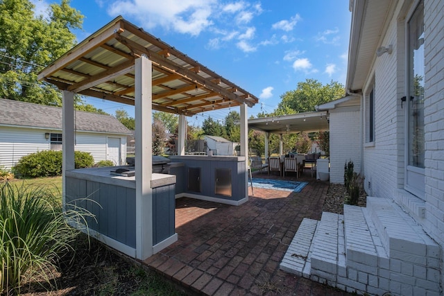 view of patio / terrace with a jacuzzi