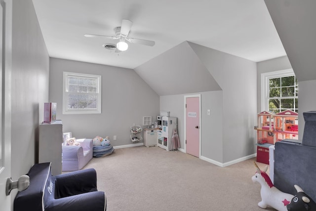 playroom featuring vaulted ceiling, ceiling fan, and light colored carpet