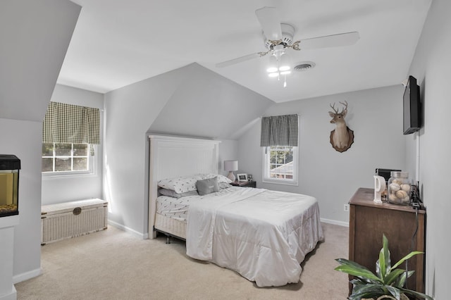 bedroom with ceiling fan, light carpet, and lofted ceiling