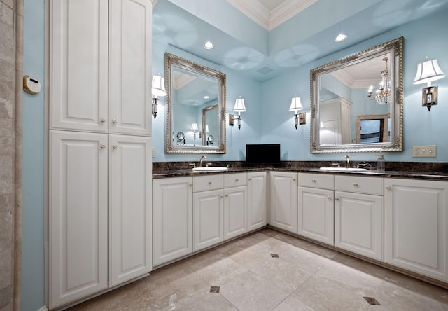 bathroom featuring ornamental molding and vanity