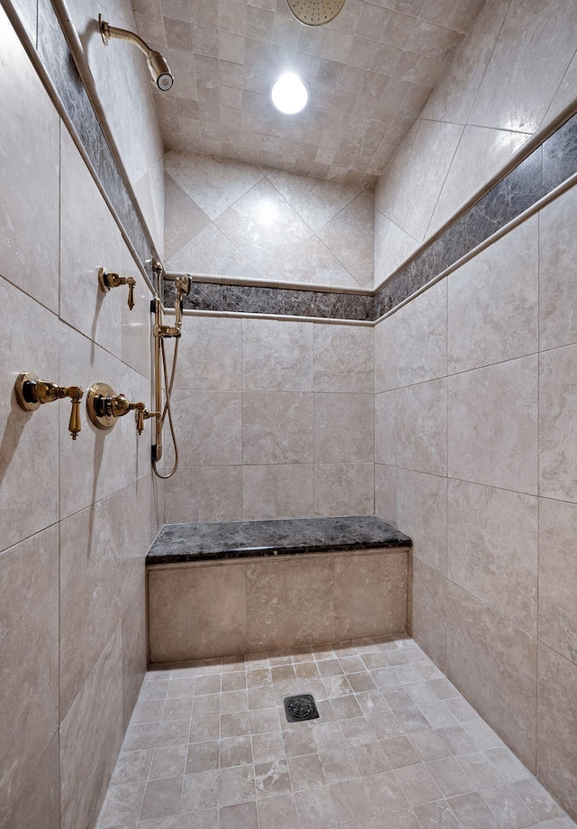 bathroom with a tile shower