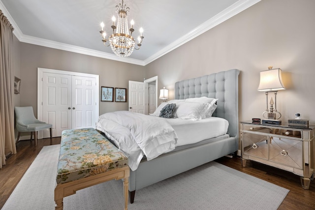 bedroom featuring dark hardwood / wood-style floors, an inviting chandelier, and ornamental molding