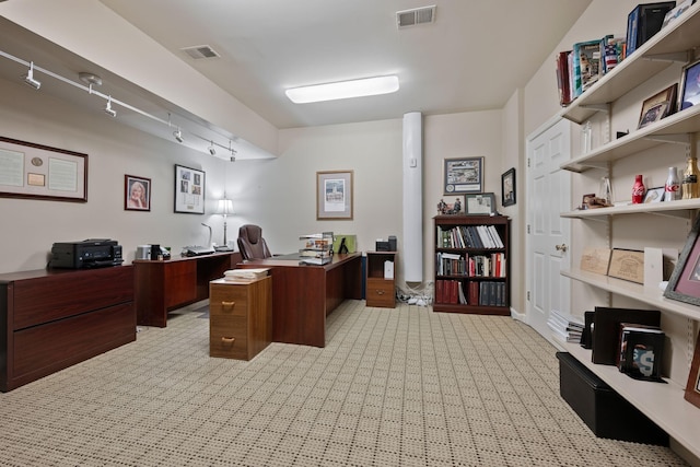 office area featuring light carpet and track lighting