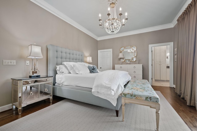 bedroom featuring dark wood-type flooring, ornamental molding, and a notable chandelier