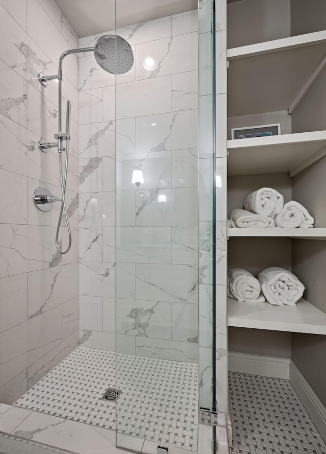 bathroom with a shower with shower door