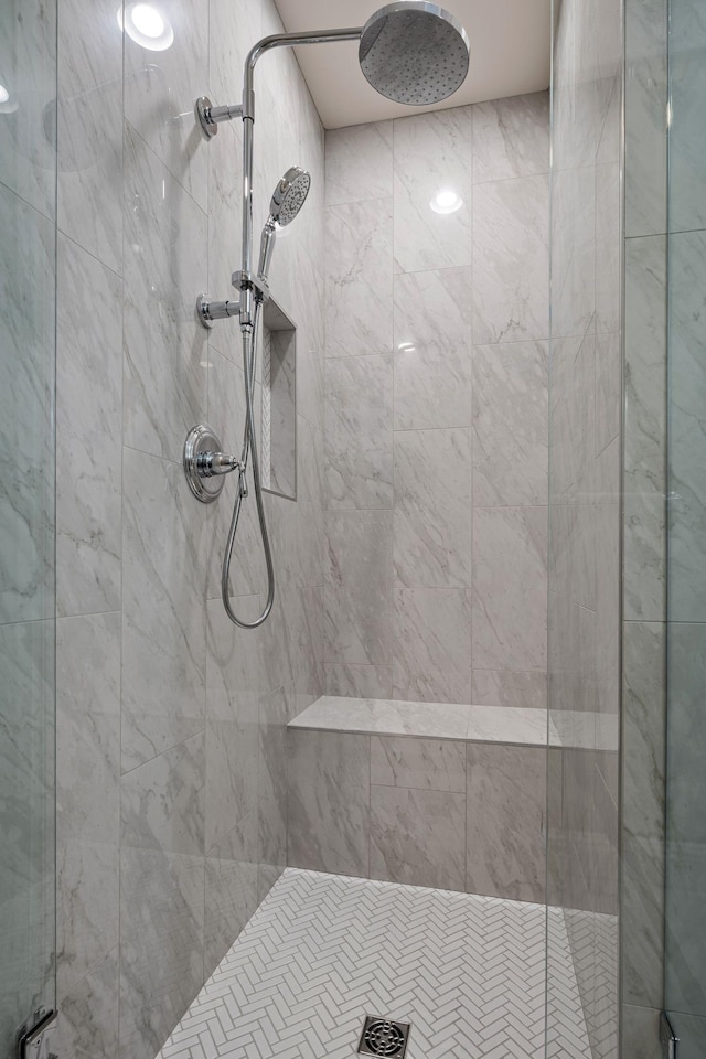 bathroom with a tile shower