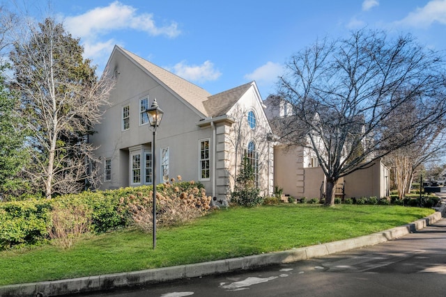 view of home's exterior with a yard