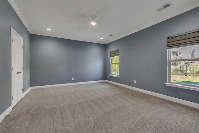 carpeted empty room with crown molding