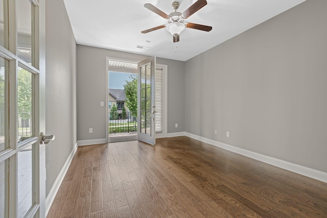 spare room featuring ceiling fan, french doors, and hardwood / wood-style flooring