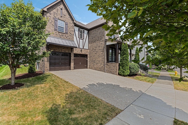 view of front of home with a front lawn and a garage