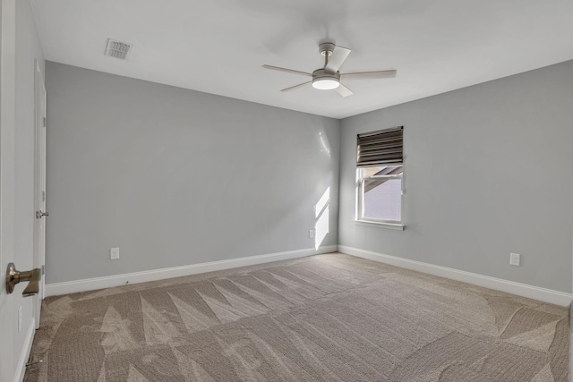 carpeted empty room with ceiling fan