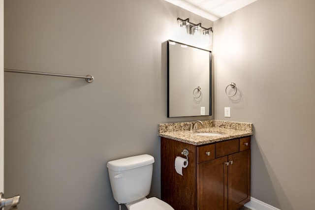 bathroom featuring toilet and vanity