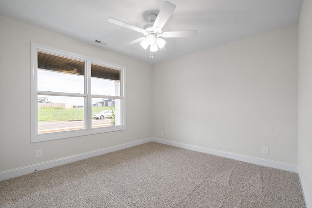 unfurnished room featuring ceiling fan and carpet flooring