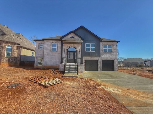 view of front of house featuring brick siding, concrete driveway, and an attached garage